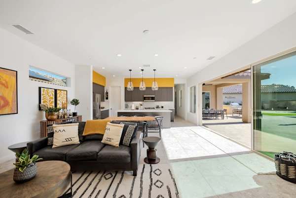 Living room area with views of the sunny outdoors.