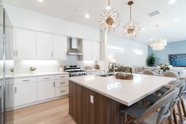 White quartz island with wood cabinetry.