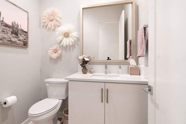 Powder Room: Half bath with statement lighting—modern fixtures and clean lines.
