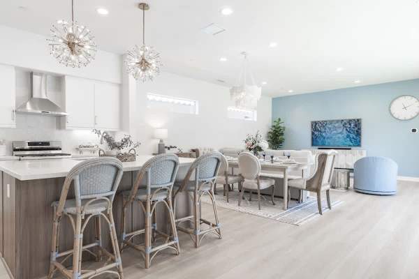 Open kitchen & dining area with skylights flooding the space with natural light.