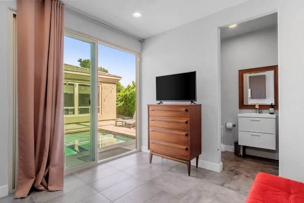 Casita bedroom with pool access—sliding glass to your private entrance outside.