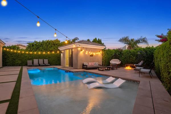 Blue water sparkles as sunset fades—ledge loungers invite you to float under desert stars nightly.