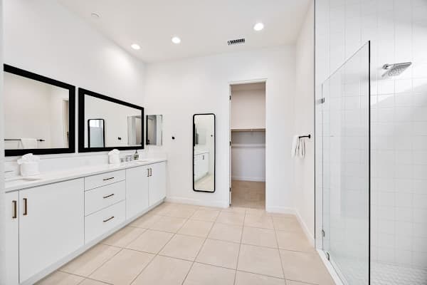 Spacious primary bath with dual vanities.