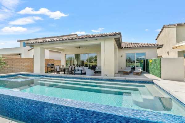 Infinity pool with sun shelf and spa.