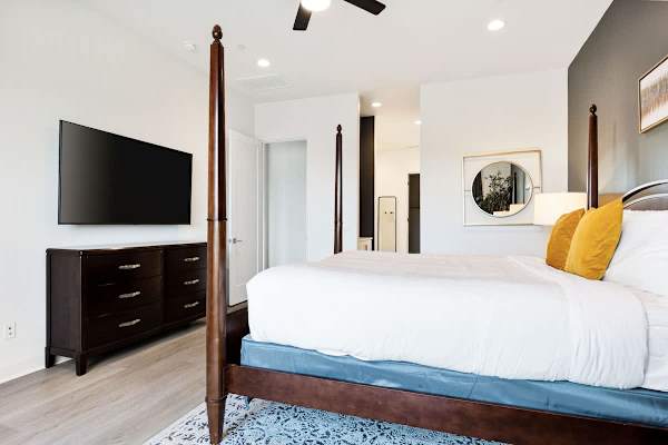 Primary suite blends comfort with modern entertainment.