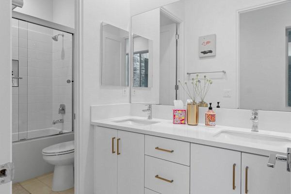 Guest bath with tub-shower combo.