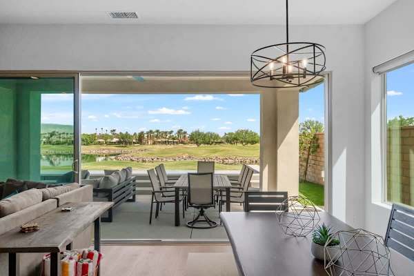 Open living flows to covered patio.