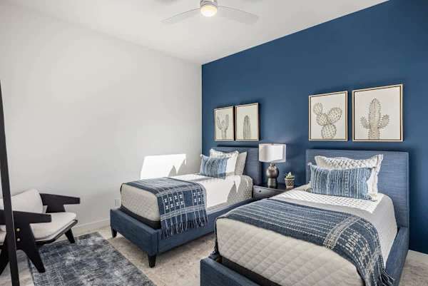 Bedroom 2 has two single beds.
