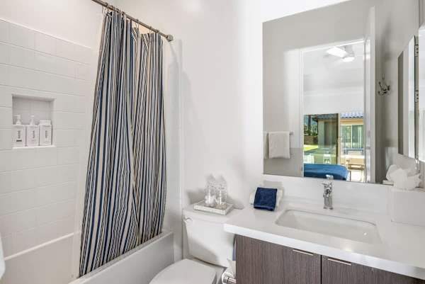 Bedroom 2 Bathroom has a shower/tub combo with all the essentials.