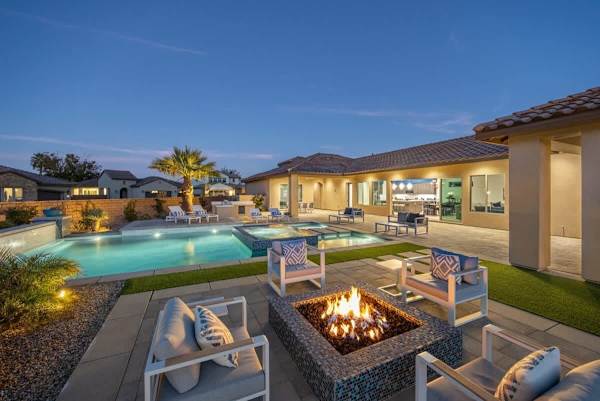Outdoor patio seating area with a fire pit.