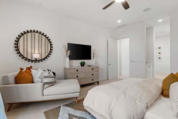 Reading nook in your bedroom—statement mirror and chaise lounge.