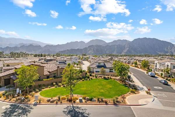 A serene community offering an open dog park, lush green spaces, and breathtaking mountain views. Perfect for relaxing strolls and outdoor living.