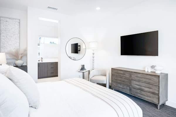 The master suite bedroom also has a TV to enjoy some late-night movies.