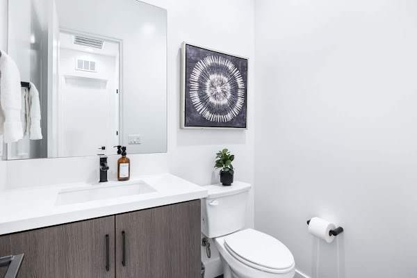 Half bathroom with the essentials you need for a quick clean up.