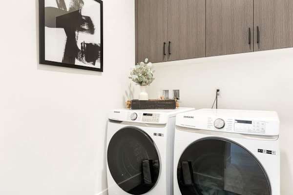 The laundry room is equipped with a matching washer and dryer to ensure you return home with clean clothes.