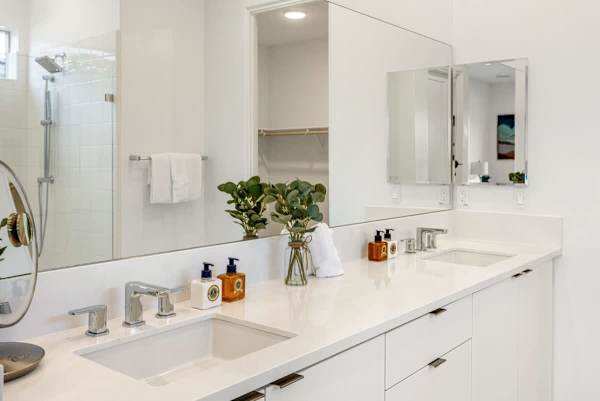 Sleek bathroom with double vanity and plenty of counter space for your essentials.