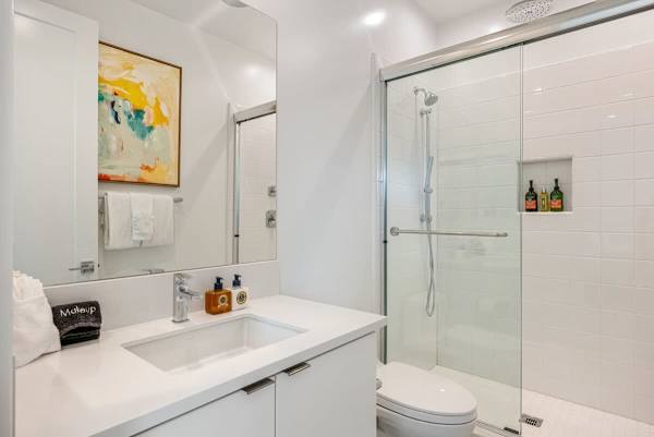 Bright bathroom with walk-in shower and modern finishes for a fresh start.