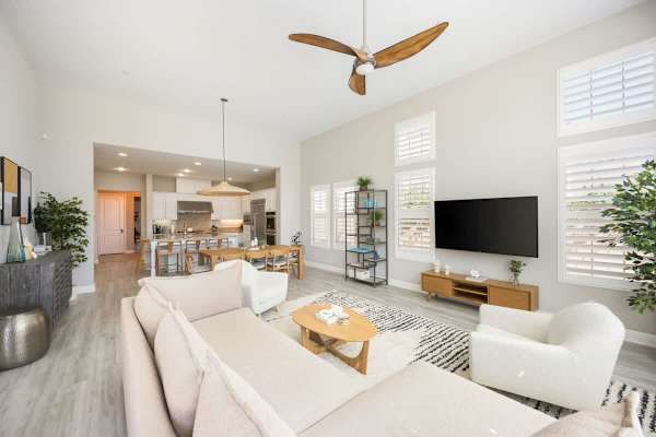 A bright living room made for relaxing together and watching some TV.