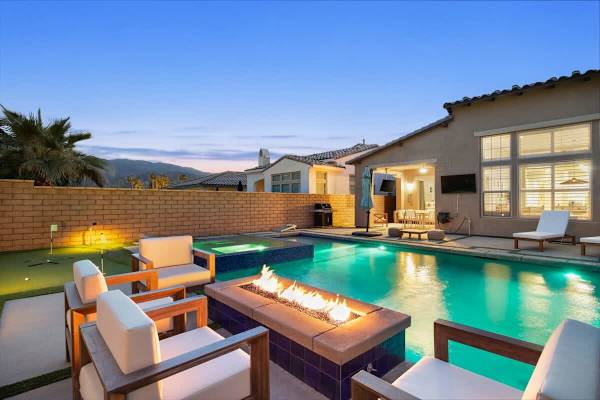 Backyard set for a relaxed evening by the fire pit.