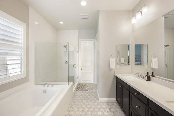 Freshen up in a clean, open master bathroom.