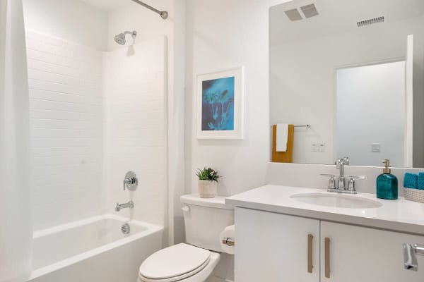 Hallway bathroom with a shower/tub combo.