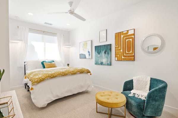 Bedroom 2 has a comfortable queen-size bed and a lovely sofa.