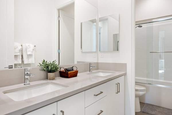 Double vanity so everyone has their own spot.