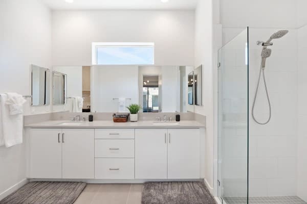 Step into a simple, bright bathroom with plenty of space.