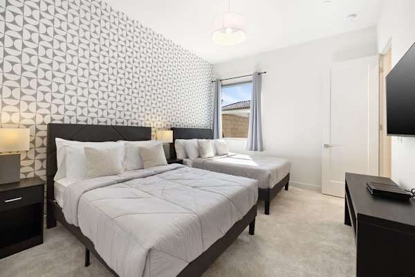 Bedroom 3 with 2 double beds for shared space.