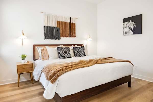 Bedroom 2 has a comfortable king-size bed with earthy colors for a restful stay.