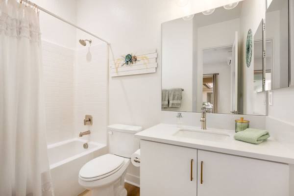 Bathroom with a shower/tub combo, perfect to get ready for the day.