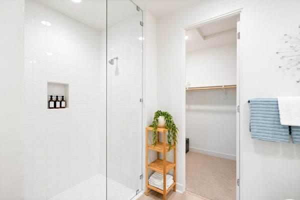A bright master bath with a walk-in shower.