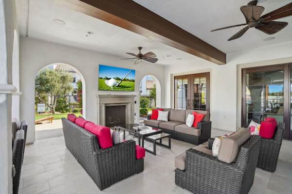 Plenty of cozy seating available for you to enjoy screen time from the outdoor smart TV.
