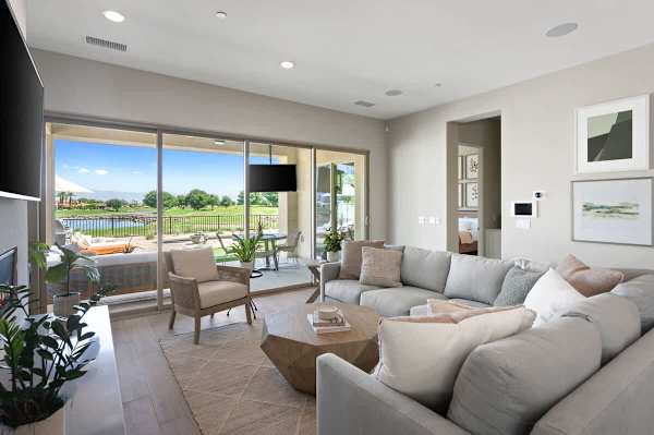 Bright living room with lake views and sliding glass doors that bring the outdoors in all day long.