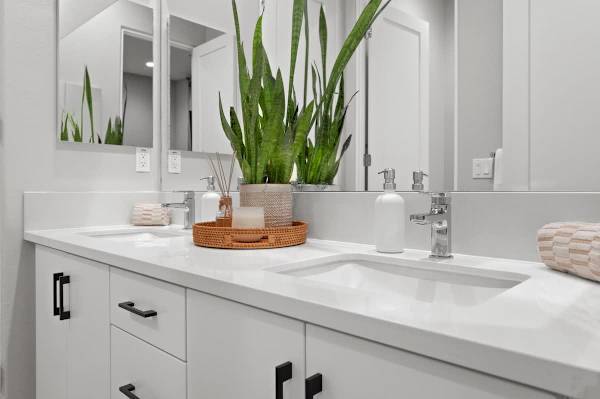 The Jack and Jill bathroom features double vanity sinks for your convenience.