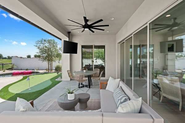 The remote controlled ceiling fan outdoors will keep you cool.