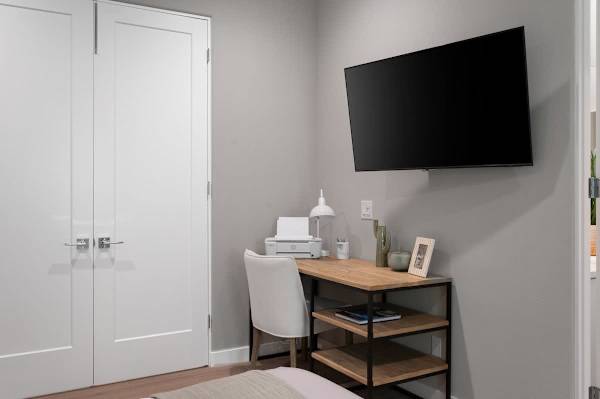 Desk and TV in the bedroom give guests a spot to check emails or catch up on their favorite shows.