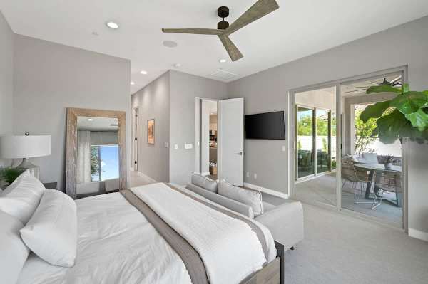 King bedroom, smart TV, and direct patio access for morning coffee by the water.