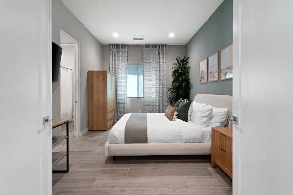 Guest bedroom features queen bed and a calm vibe perfect for restful nights here.