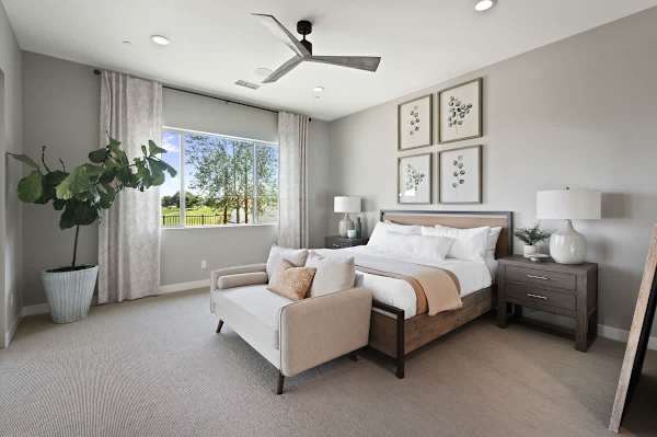 Primary bedroom with king bed and sitting area offers a peaceful place to start each day.