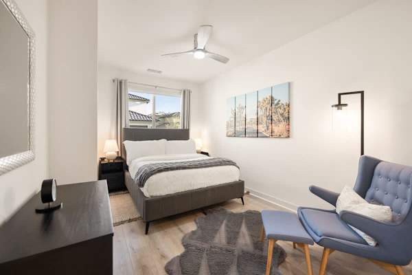 Second bedroom with queen bed, desk workspace gives guests their own private retreat.