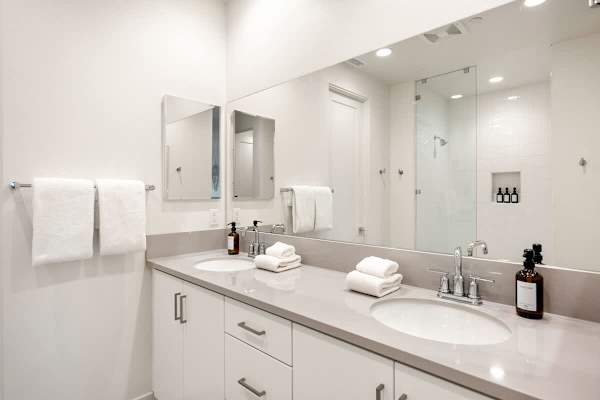 Primary bathroom with double vanity, walk-in shower, makes mornings feel like a spa day.