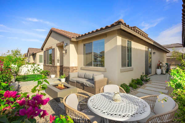 Private backyard patio with dining area surrounded by desert blooms all around you.