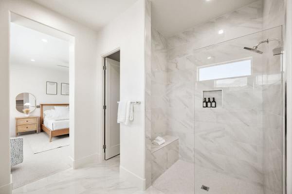 Master suite bathroom with a clean walk-in shower to start your day refreshed.