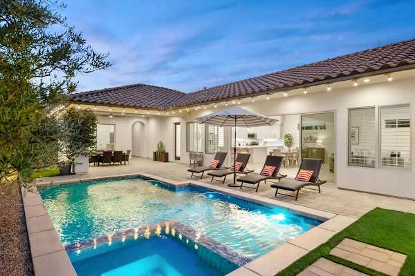 Pool and spa lighting create a calm evening setup.