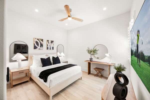 Suite 2 has a comfortable queen-size bed and a TV.