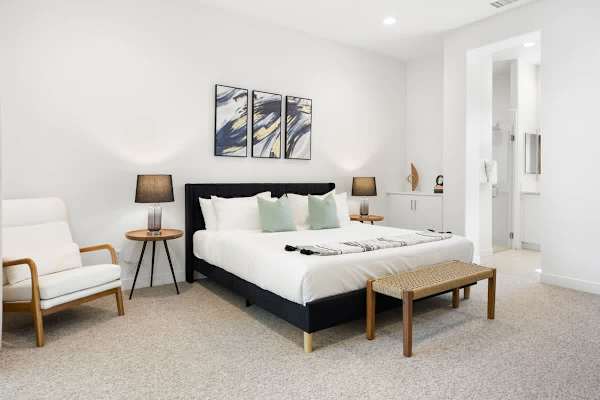 Primary bedroom with king bed and plenty of natural light.
