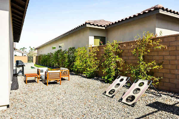 Gravel lounging area add extra fun when you want to play games outside here.