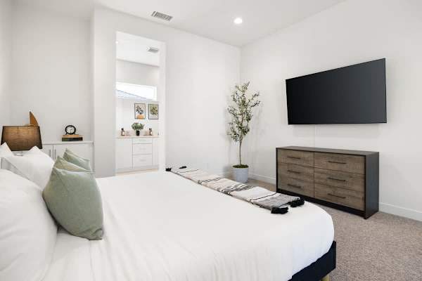 Peaceful neutral tones creates the perfect environment for restful sleep here.