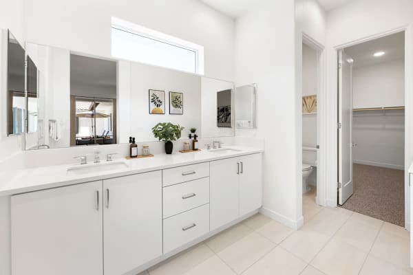 Spacious primary bath with dual sinks gives couples plenty of room to get ready each day.